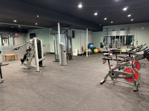 Gym Image: Trap machine, stationary bikes, row machines, yoga balance balls